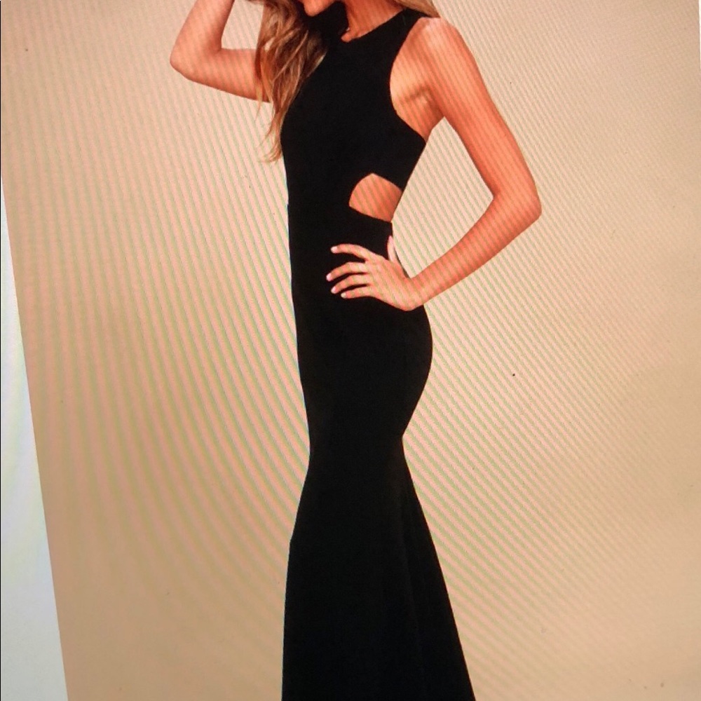 Beautiful black classic dress with cut outs!
